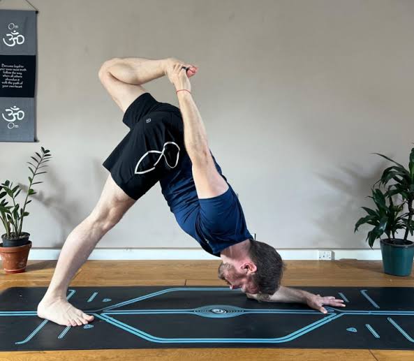 Transition to Forearms (Dav Jones Yoga) - A key step in Dolphin Pose, lowering forearms to the mat to build shoulder strength and stability for the pose.